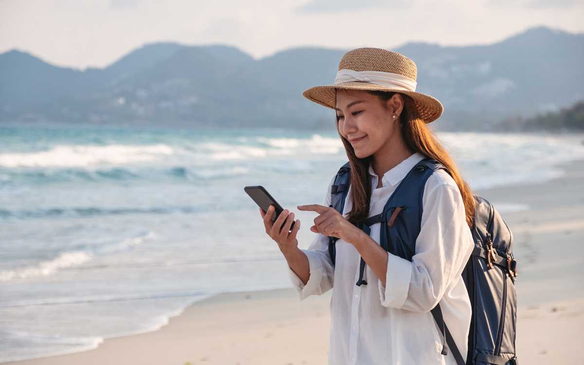 esim phone beach shutterstock 1950415570 Blue Titan